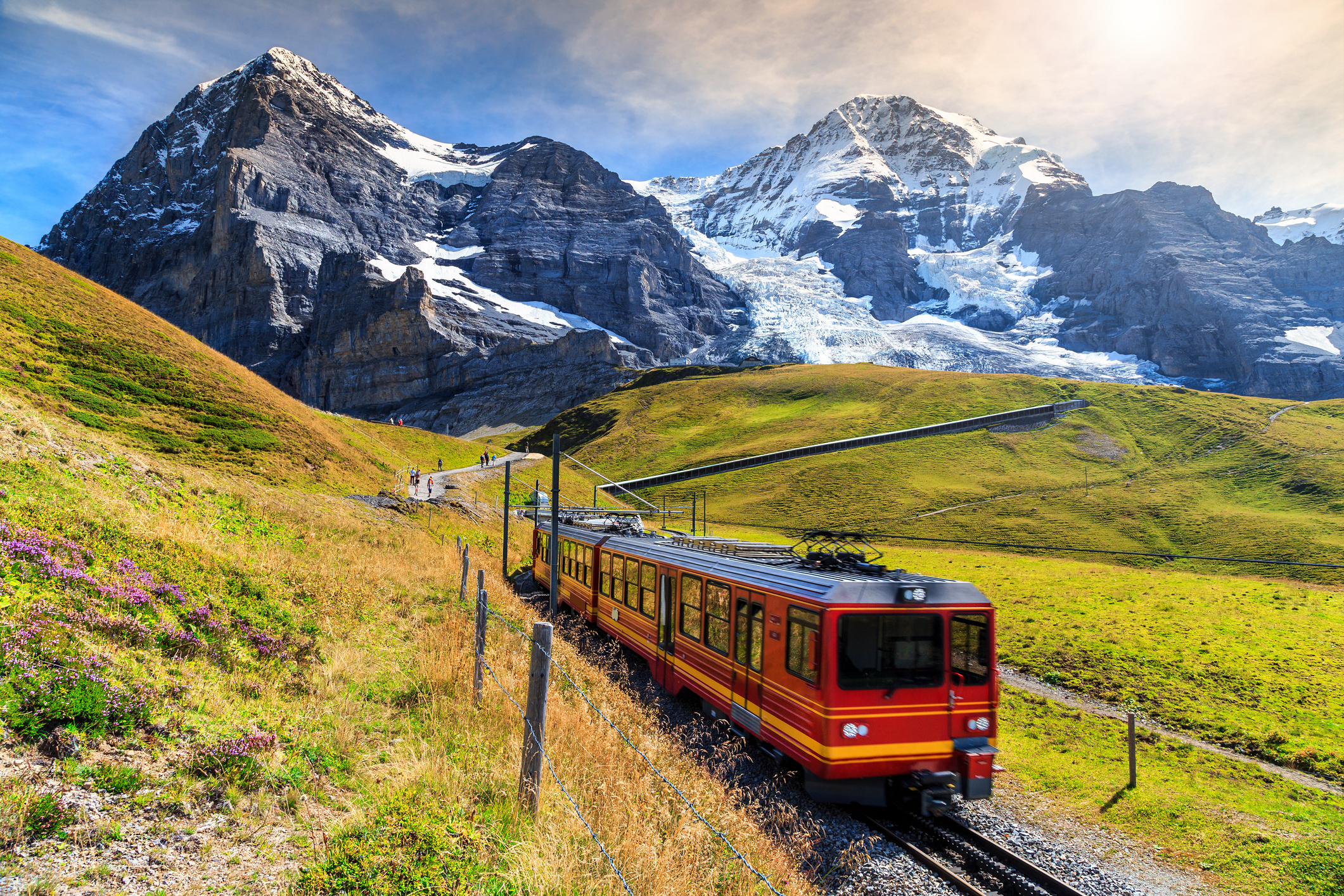 Famous electric red tourist train coming down from the Jungfraujoch station in Kleine Scheidegg,Bernese Oberland,Switz